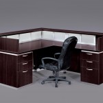 brown cubicle with black chair on wheels